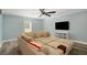 Comfortable living room with a large sectional sofa, ceiling fan and a flat screen tv at 4685 Prater Se Way, Smyrna, GA 30080