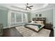 Relaxing main bedroom features tray ceilings, and plush carpet, creating a cozy retreat at 4685 Prater Se Way, Smyrna, GA 30080