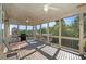 Covered porch with ceiling fans overlooks a private backyard surrounded by mature trees at 4685 Prater Se Way, Smyrna, GA 30080