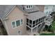 Upper view of home's screened porch with stairs leading to stone patio at 4685 Prater Se Way, Smyrna, GA 30080