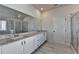 Bathroom with granite countertop, double vanity, and walk-in shower at 57 Longhorn Way, Auburn, GA 30011