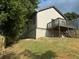 Backyard featuring a wooden deck, green grass, and a freshly painted exterior at 556 Paines Nw Ave, Atlanta, GA 30318