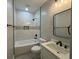 Clean bathroom with white tiled walls, a modern vanity, and matte black accents for a sleek look at 556 Paines Nw Ave, Atlanta, GA 30318