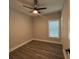 Bedroom features wood-look floors, a ceiling fan, and a bright window at 556 Paines Nw Ave, Atlanta, GA 30318