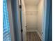 Walk-in closet features wood-look floor and white wire shelving at 556 Paines Nw Ave, Atlanta, GA 30318