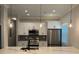Modern kitchen with marble countertops, stainless steel appliances, and pendant lighting at 556 Paines Nw Ave, Atlanta, GA 30318