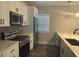 Modern kitchen with stainless steel appliances, marble countertops, and plenty of storage at 556 Paines Nw Ave, Atlanta, GA 30318