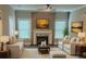 Cozy living room featuring a fireplace, modern furniture, and large windows with natural light at 556 Paines Nw Ave, Atlanta, GA 30318