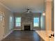Open living space with a stone fireplace, hardwood floors, and large windows for natural light at 556 Paines Nw Ave, Atlanta, GA 30318