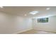 Finished basement with large windows and hardwood floors at 5490 Conway Dr, Marietta, GA 30068