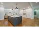 Gray kitchen island with white quartz countertop and seating at 5490 Conway Dr, Marietta, GA 30068