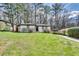 White brick ranch house with gray trim, situated on a grassy lot at 2740 Rollingwood Se Ln, Atlanta, GA 30316