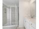 Modern bathroom featuring tiled walk-in shower, white vanity, and sleek fixtures at 3254 Durston Ct, Dacula, GA 30019