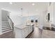 View of the home's kitchen features a granite island and stainless appliances at 3254 Durston Ct, Dacula, GA 30019