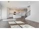 Open-concept living area features modern lighting, and a view of the staircase to the upper level at 3254 Durston Ct, Dacula, GA 30019