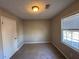 Simple bedroom with carpet flooring and neutral decor at 3725 Linwood Way, Snellville, GA 30039