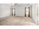 Main bedroom with carpeted floors and ceiling fan at 6094 Whitetail Deer Run, Mableton, GA 30126