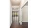 Hallway with hardwood floors leading to living area at 6094 Whitetail Deer Run, Mableton, GA 30126