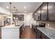 Modern kitchen with granite countertops and dark cabinetry at 6094 Whitetail Deer Run, Mableton, GA 30126