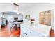 Kitchen with island, white cabinets, and views into Gathering room at 1841 Hedge Rose Dr, Atlanta, GA 30324