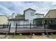 Spacious deck with a white vinyl exterior and dark brown railing at 5958 King Way Walk, Lithonia, GA 30058