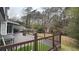 Deck with firepit and wooded backdrop at 5958 King Way Walk, Lithonia, GA 30058