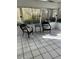 Bright sunroom with tile floors and wicker furniture, perfect for relaxing at 5958 King Way Walk, Lithonia, GA 30058