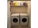 Laundry room showcasing side-by-side LG front load machines with shelf at 6603 Biscayne Blvd, Rex, GA 30273