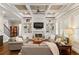 Bright living room featuring built-in shelving, a fireplace, and hardwood floors at 2330 Tayside Nw Xing, Kennesaw, GA 30152