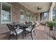 Spacious screened porch with seating area and brick exterior at 2330 Tayside Nw Xing, Kennesaw, GA 30152