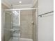Clean bathroom with a tiled shower and glass enclosure at 2367 Millhaven Se St # 15, Smyrna, GA 30080