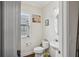 Small bathroom with toilet, sink, and decorative artwork at 2367 Millhaven Se St # 15, Smyrna, GA 30080