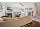 Open living area with sectional sofa, fireplace, and hardwood floors at 2367 Millhaven Se St # 15, Smyrna, GA 30080