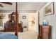Spacious bedroom featuring wood furniture, carpeted floors, and large closet at 3472 Honeycomb Se Dr, Conyers, GA 30094