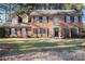 Charming brick two-story home with manicured front yard and black window shutters at 3472 Honeycomb Se Dr, Conyers, GA 30094