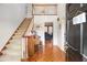Inviting home foyer with hardwood floors, staircase, and entry to other rooms at 3472 Honeycomb Se Dr, Conyers, GA 30094