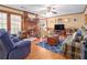 Comfortable living room featuring a fireplace, wood floors, and ample seating at 3472 Honeycomb Se Dr, Conyers, GA 30094