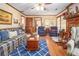 Bright living room with a fireplace, plush seating, and a blue and white patterned rug at 3472 Honeycomb Se Dr, Conyers, GA 30094