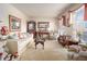 Cozy living room with neutral carpet, plush seating, and plenty of natural light at 3472 Honeycomb Se Dr, Conyers, GA 30094