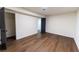 This bedroom has hardwood floors, neutral paint, closet and a gray door leading to another room at 3800 William Paul Dr, Austell, GA 30106
