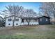 Charming home featuring a welcoming porch, modern paint, and landscaped front yard at 3800 William Paul Dr, Austell, GA 30106