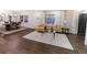 Bright living room featuring hardwood floors, neutral decor, and ample natural light at 3800 William Paul Dr, Austell, GA 30106