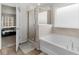 Spa-like bathroom with shower and garden tub at 7767 Richmond Trl, Fairburn, GA 30213