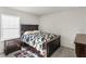 Bedroom with dark brown furniture and cow print bedding at 7767 Richmond Trl, Fairburn, GA 30213