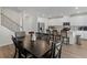 Modern kitchen with white cabinets, granite countertops, and stainless steel appliances at 7767 Richmond Trl, Fairburn, GA 30213