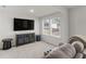 Relaxing media room featuring a large TV and comfortable seating at 7767 Richmond Trl, Fairburn, GA 30213