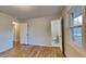Well-lit bedroom with hardwood floors and private half bath at 4129 Shorter Way, Decatur, GA 30034