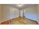 Bright bedroom featuring hardwood floors and multiple closets at 4129 Shorter Way, Decatur, GA 30034