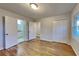 Main bedroom with hardwood floors and access to bathroom at 4129 Shorter Way, Decatur, GA 30034