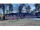 Brick ranch house with a large front yard and mature trees at 4129 Shorter Way, Decatur, GA 30034